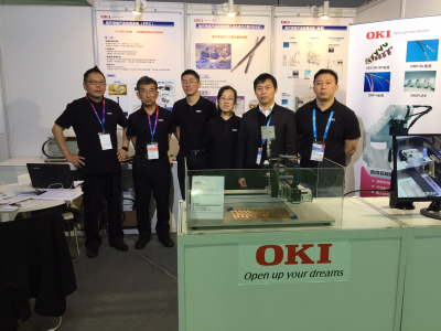 Staff attending Oki Electric Cable's booth 