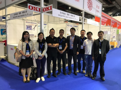 Staff attending Oki Electric Cable's booth